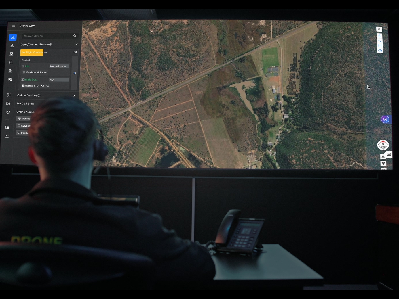Remote pilot overseeing a drone mission from a control room console, from official DJI Dock 4 imagery.