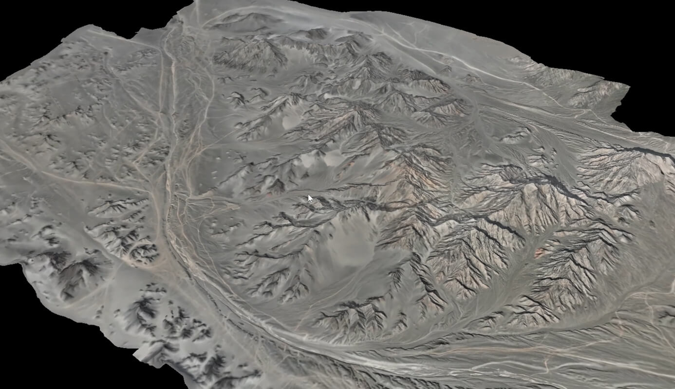 High-detail 3D photogrammetric mesh of a terrain and mountain range reconstructed from DJI Matrice 4E aerial imagery.