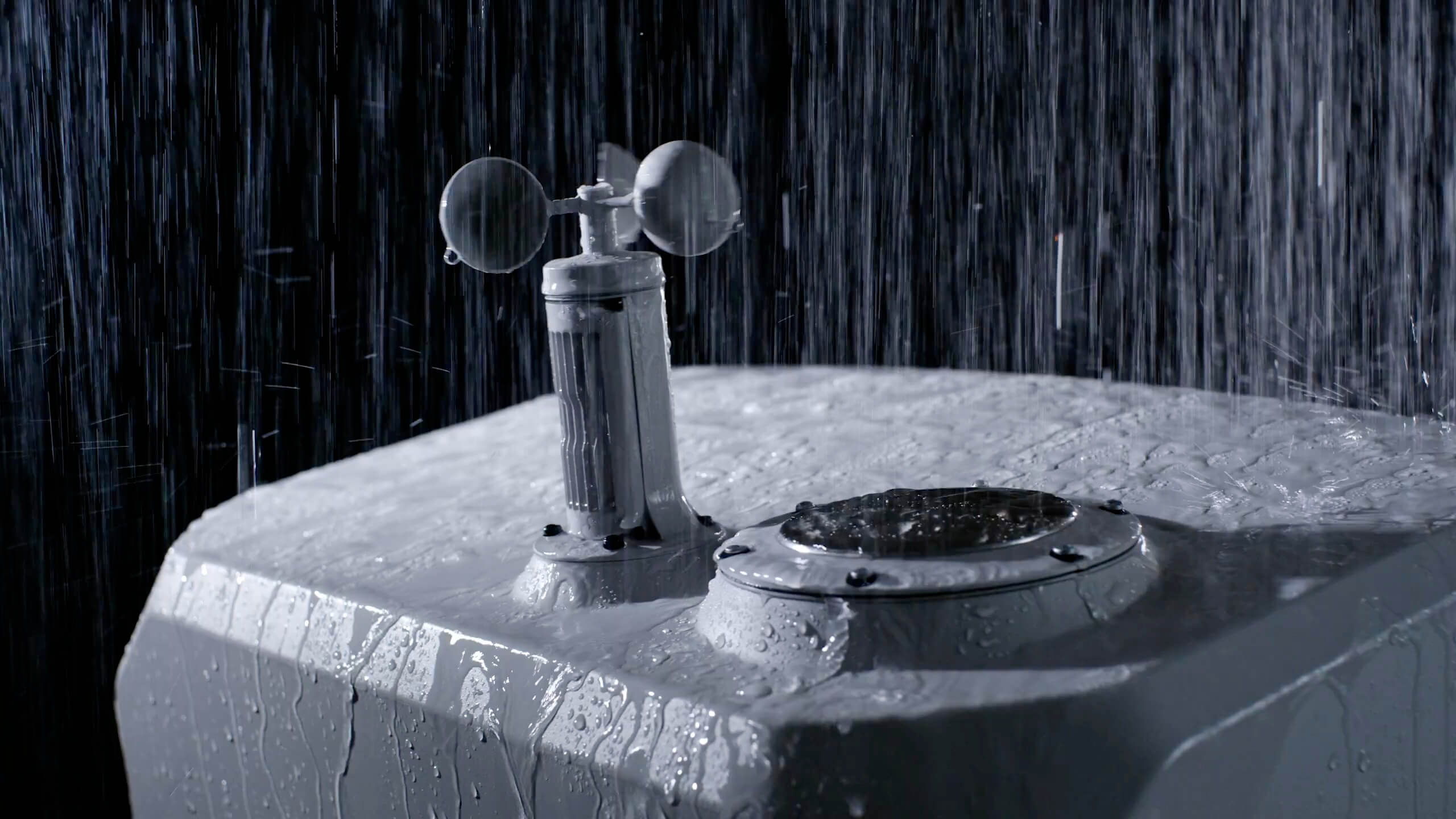 DJI dock weather sensor operating in heavy rain.