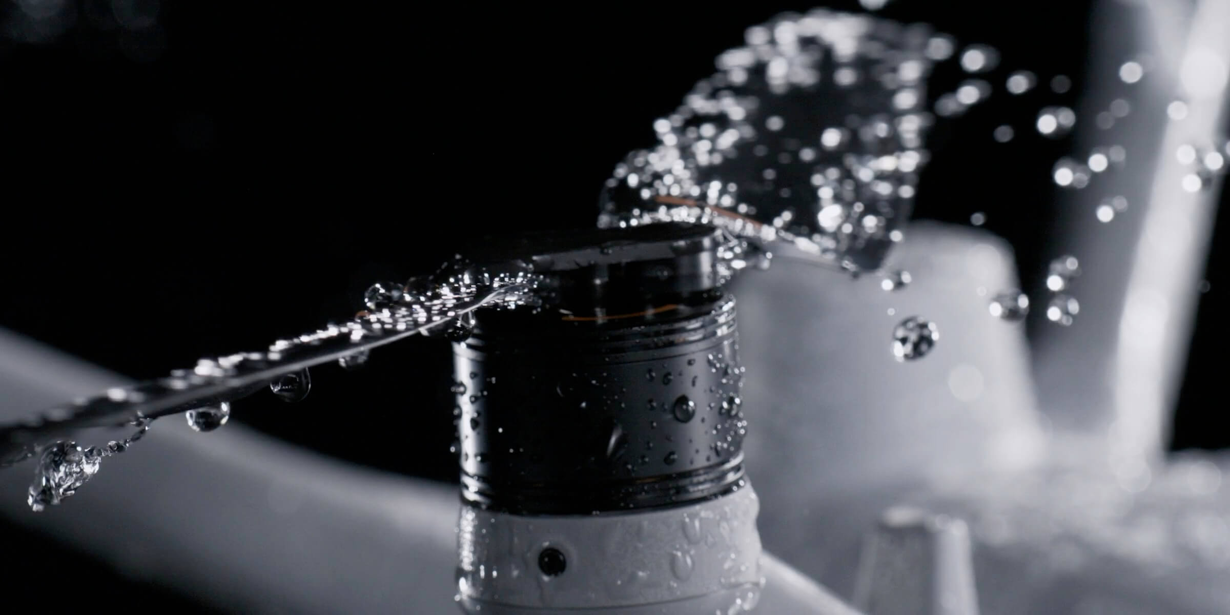 Close-up of a DJI Matrice 4D-series propeller with water droplets in official Dock 3 product imagery.