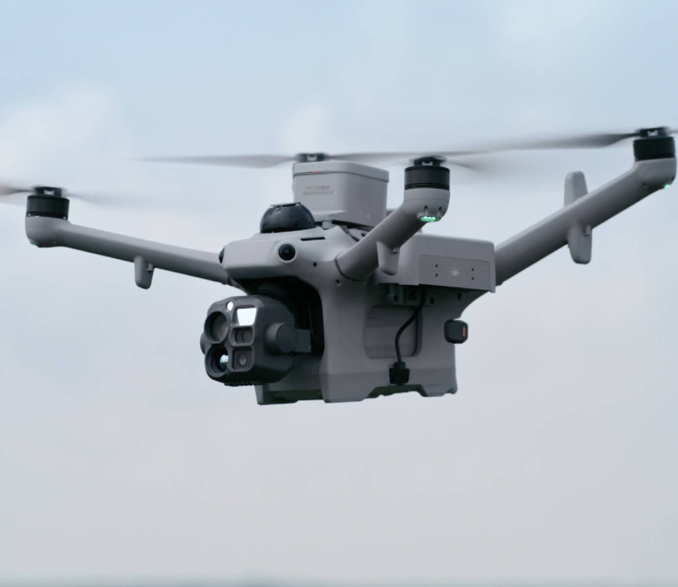 DJI Matrice 5TD flying with its camera system and rotor motion visible.