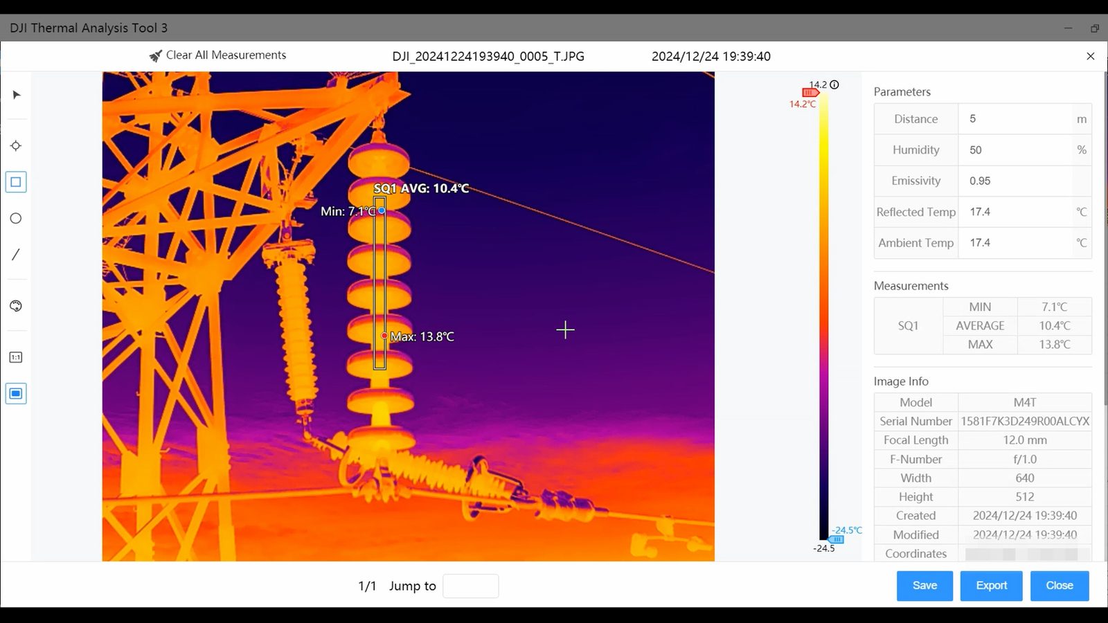 Radiometric thermal image of a high-voltage transmission tower and insulator string with a temperature scale.