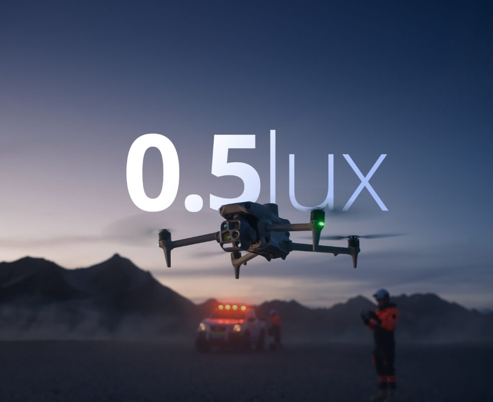 DJI Matrice 4 Series drone hovering in a dusty low-light scene with a 0.5 lux capability graphic overlay.