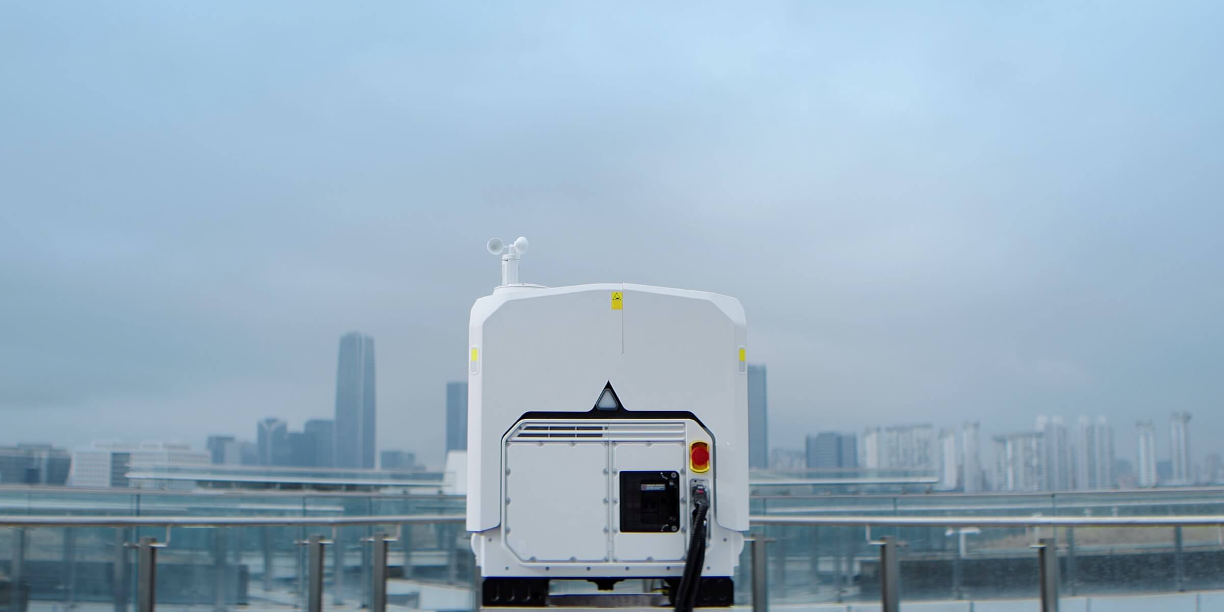 DJI Dock 4 on a rooftop with its power and network cable connected.