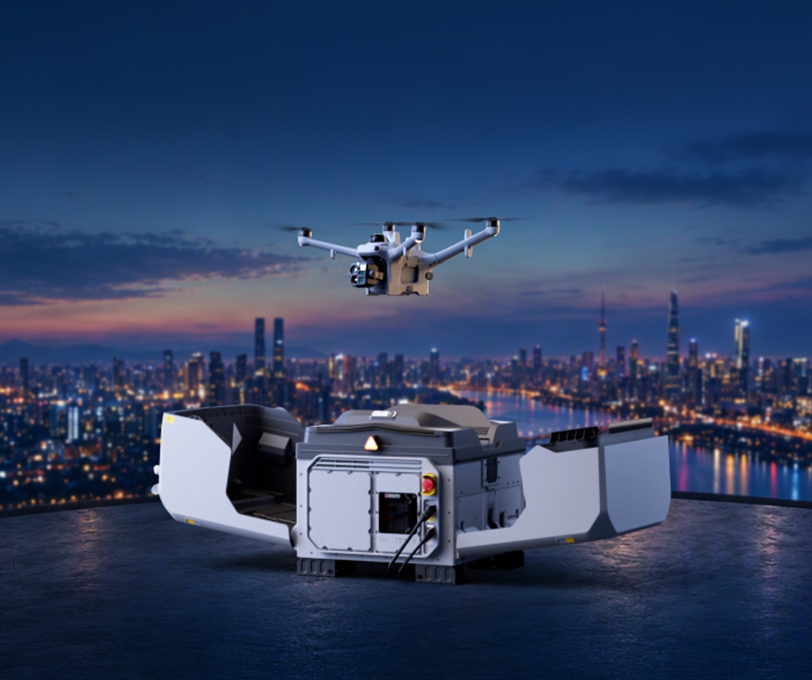 DJI Matrice 5TD lifting off from an open DJI Dock 4 on a rooftop above a city at dusk, from official DJI imagery.