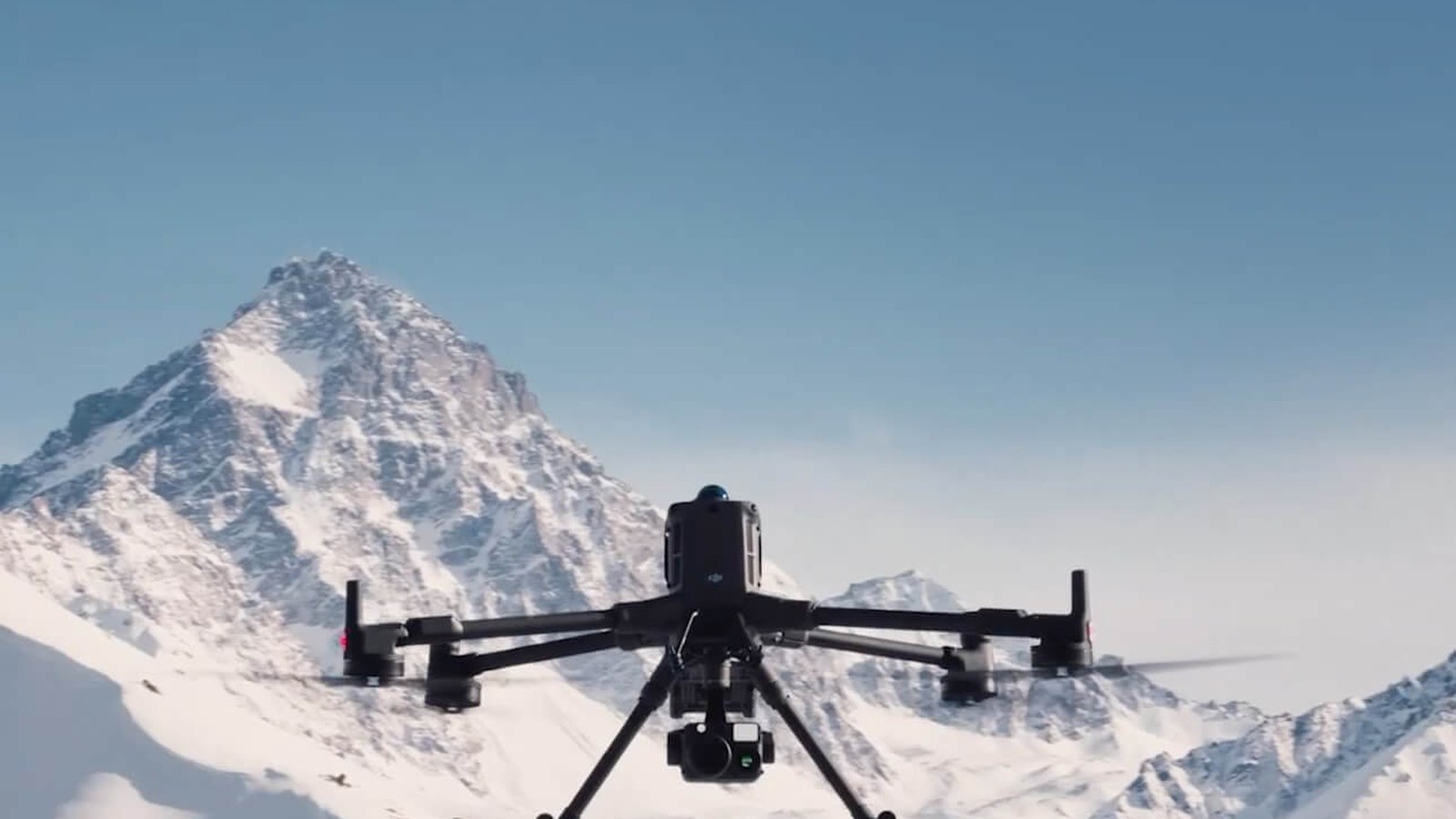 DJI Matrice enterprise drone flying through a cold-weather utility inspection environment.